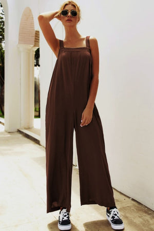 Chocolate square-neck palazzo jumpsuit with wide legs and pockets.