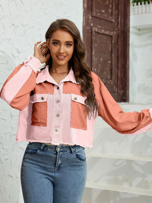 Textured colorblock cropped jacket with raw edges in pink and coral, featuring button front and chest pockets.
