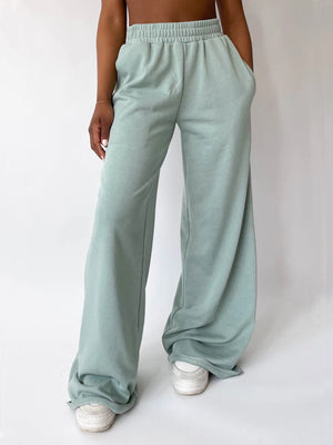 Light green wide-leg lounge pants with elastic waistband and pockets
