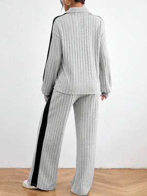 Light gray ribbed loungewear set with contrast black side stripes on sleeves and pants.