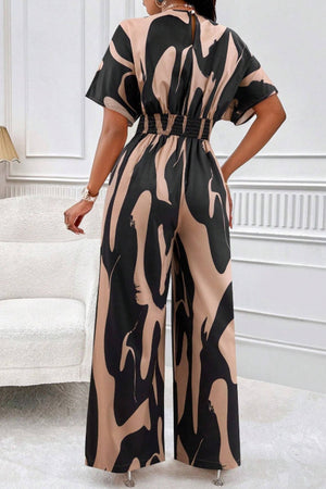 Abstract brushstroke wide-leg jumpsuit in taupe and black with short sleeves and elastic waist
