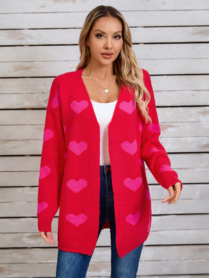 Red acrylic cardigan with pink heart intarsia pattern, open front, long sleeves.