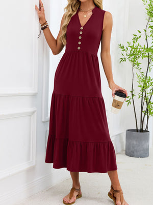 Burgundy tiered midi dress with V-neck and decorative buttons.