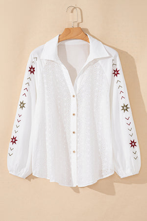 White embroidered eyelet blouse with poet sleeves and star details