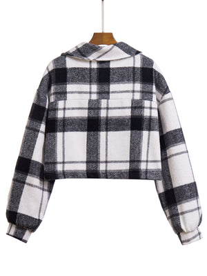 Chic plaid jacket in black and white with buttoned front and chest pocket.