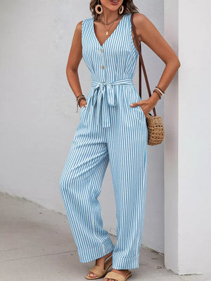 Light blue striped tie-waist wide leg romper with decorative buttons and pockets.