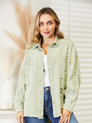 Light green distressed denim overshirt with raw hem and button front.