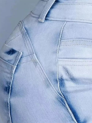 Light blue wash cotton spandex jeans with high waist and pocket detail.