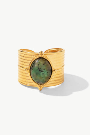 Textured gold cuff ring with a green tiger's eye stone and boho design.