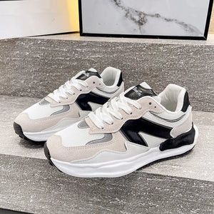 Panelled retro runner sneakers in beige and black with white mesh and suede accents.
