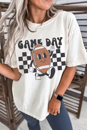 Cream polyester graphic tee with cartoon football and GAME DAY text on checkered background.