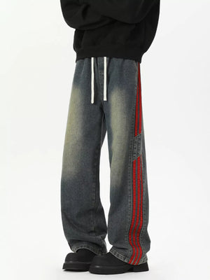 Relaxed fit wide-leg jeans in Vintage Blue with red striped detail and drawstring waist.