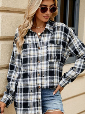 Distressed plaid overshirt in black, white, and tan with relaxed fit and button front.