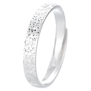 Textured sterling silver ring with a hammered finish.