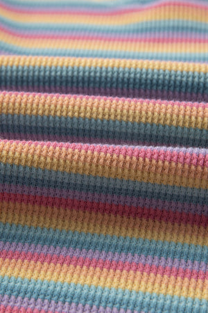 Rainbow stripe lounge set fabric detail, soft cotton waffle knit with pastel stripes.