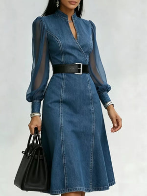 Denim midi dress with sheer puff sleeves, V-neck, and a black belt.