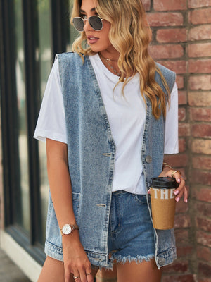 Medium wash denim vest with patch pockets and button front, worn over a white tee.