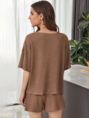 Brown waffle knit henley loungewear set with short sleeves and shorts.