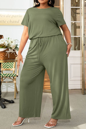 Moss green relaxed fit jumpsuit with short sleeves, drawstring waist, and wide legs.