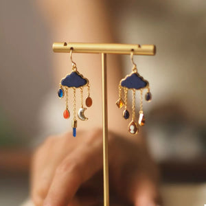 18K gold-plated blue cloud dangle earrings with colorful charms and a moon accent.