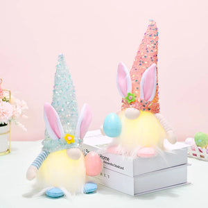 Easter bunny gnomes with sequin cone hats and bunny ears, one light blue, one coral.