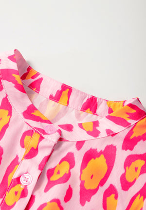 Pink leopard print blouse with button front and mandarin collar.