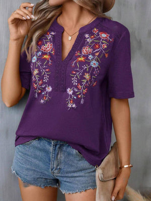 Violet embroidered v-neck tee with crochet trim and short sleeves.
