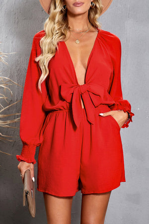 Scarlett tie-front blouson sleeve playsuit with ruffled cuffs and a deep V-neck.