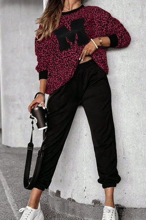 Burgundy leopard print loungewear set with black "M" appliqué on top and black joggers.