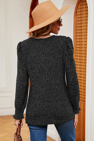 Black ribbed tee with puff sleeves and ruffled cuffs, square neck.