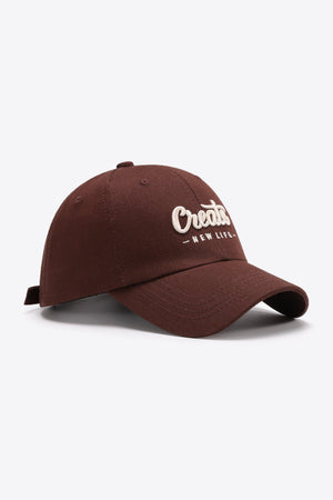 Burnt Umber baseball cap with embroidered "Create New Life" text.