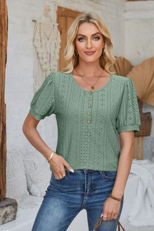 Sage green perforated puff sleeve henley blouse with button detail and eyelet pattern.
