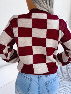 Checkerboard knit mock neck pullover sweater in burgundy and cream acrylic.