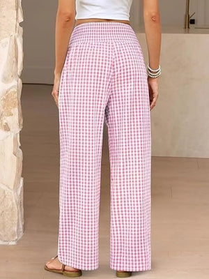 Pink plaid gingham maternity pants with smocked waistband and wide legs.