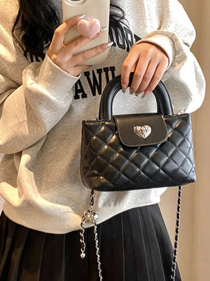Quilted Heart Lock Crossbody Bag in Black, fabric detail