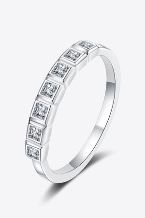 Silver band ring with princess-cut diamonds in square settings