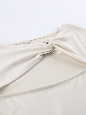 Beige knot front cutout long-sleeve shirt with a body-hugging fit.