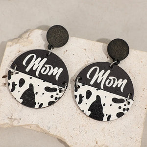 Textured wood drop earrings with "Mom" text and cow print detail