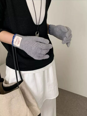 Gray ribbed knit gloves with blue trim, featuring a scalloped cuff detail.