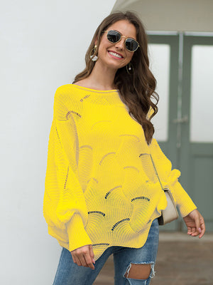 Yellow knit sweater with boat neck, balloon sleeves, and scalloped cutout pattern.