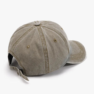 Faded denim baseball cap in mocha with distressed details and adjustable strap.