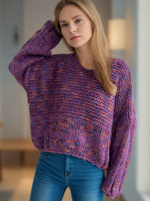 Textured knit sweater in purple with balloon sleeves and a speckled multicolor yarn.