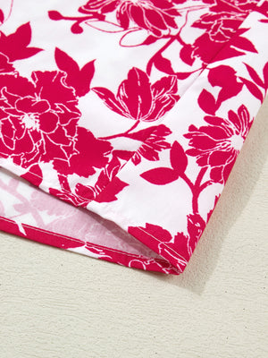 White polyester blouse with bold pink floral print and lace detail.