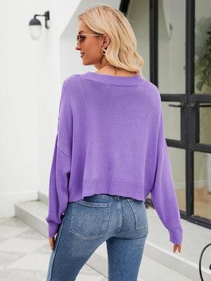 Purple cropped V-neck knit cardigan with ribbed hem and cuffs.