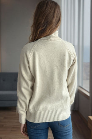Cream speckled Donegal turtleneck pullover sweater with ribbed cuffs and hem