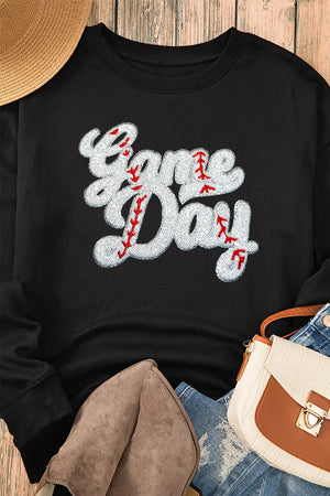Black sweatshirt with white baseball script appliqué and red stitching detail.