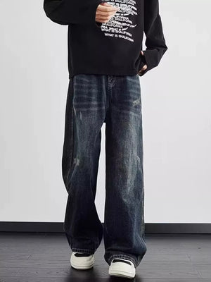 Distressed dark wash wide leg men's jeans with a relaxed fit.