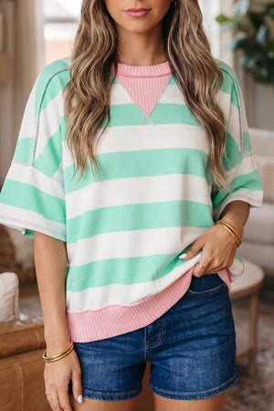 Playful Patchwork Oversized T-shirt with green and white stripes, pink neckline, and exposed seams.