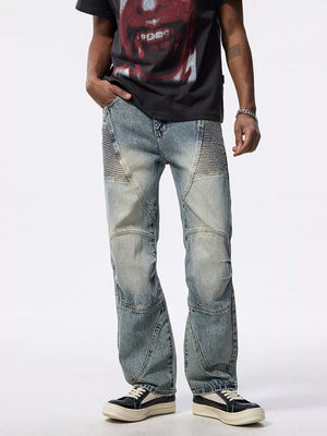 Men's light wash wide-leg moto jeans with ribbed panel details.