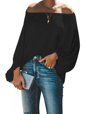 Black off-shoulder blouse with balloon sleeves and a ruffled neckline.